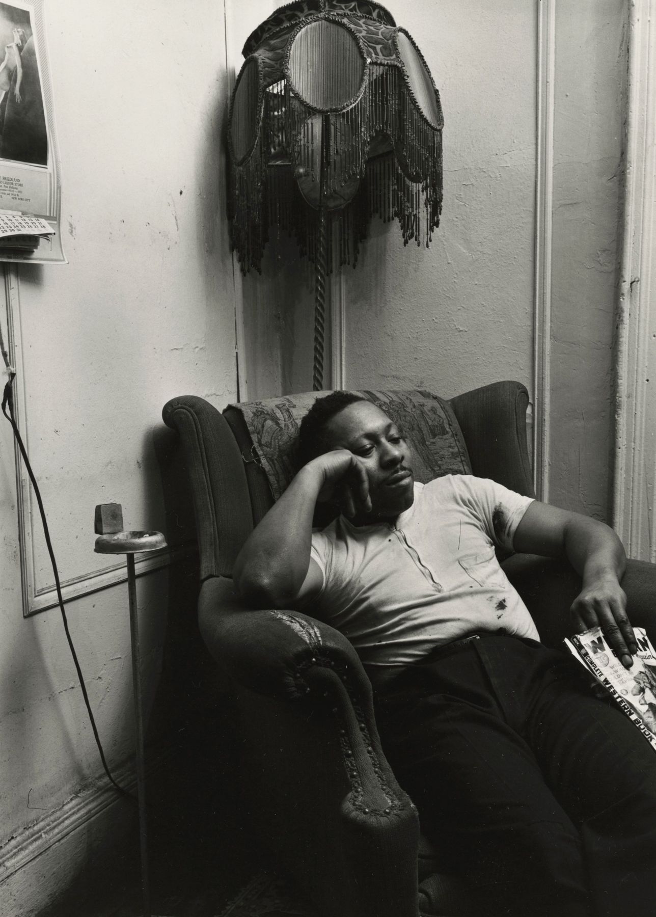 Aaron Siskind - Man with Lamp, Harlem (taken 1940-print 1981).jpg