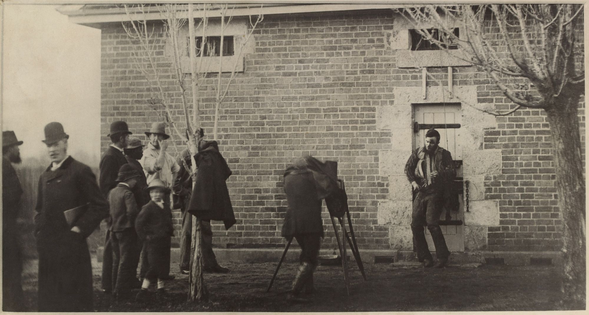 J W Lindt - Body of Joe Byrne, member of the Kelly Gang, hung up for photography, Benalla (1880).jpg