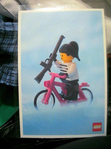 little lego girl with pink bike and assault rifle.jpg