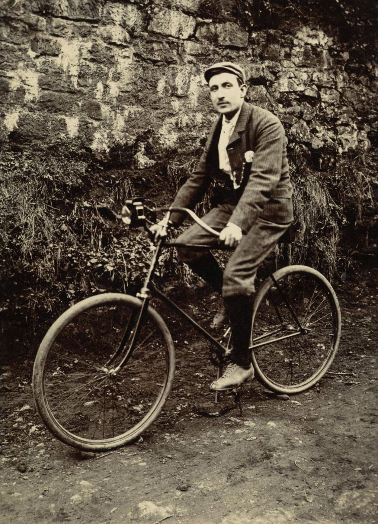 Man on a Bicycle c. 1910.jpg