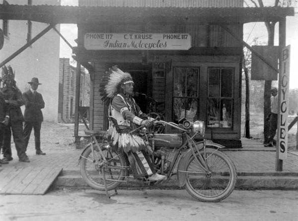 Native American Indian tries out an Indian Motorcycle (c. 1910).jpg