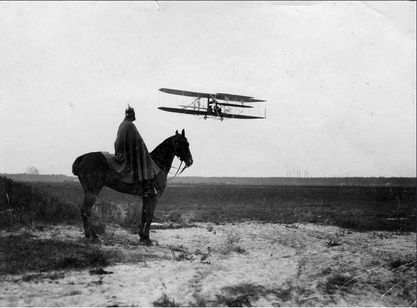 Old and new . Prussian trooper observe a biplane. 1910.jpg