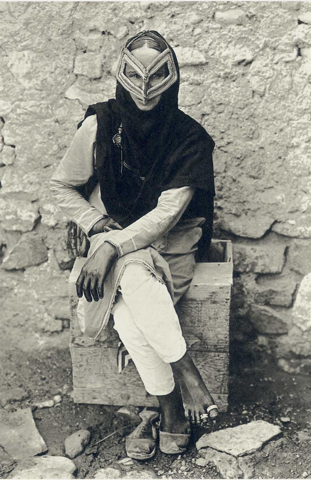 Portrait of an Arab woman wearing a traditional face mask in Muscat, Oman, 1905.jpg