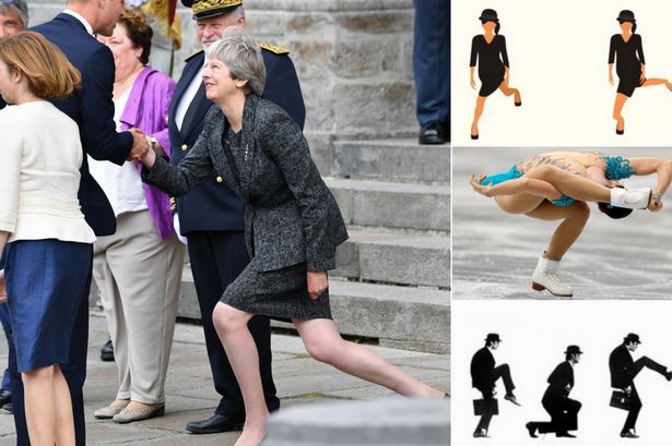 TheresaMayKneeling.jpg